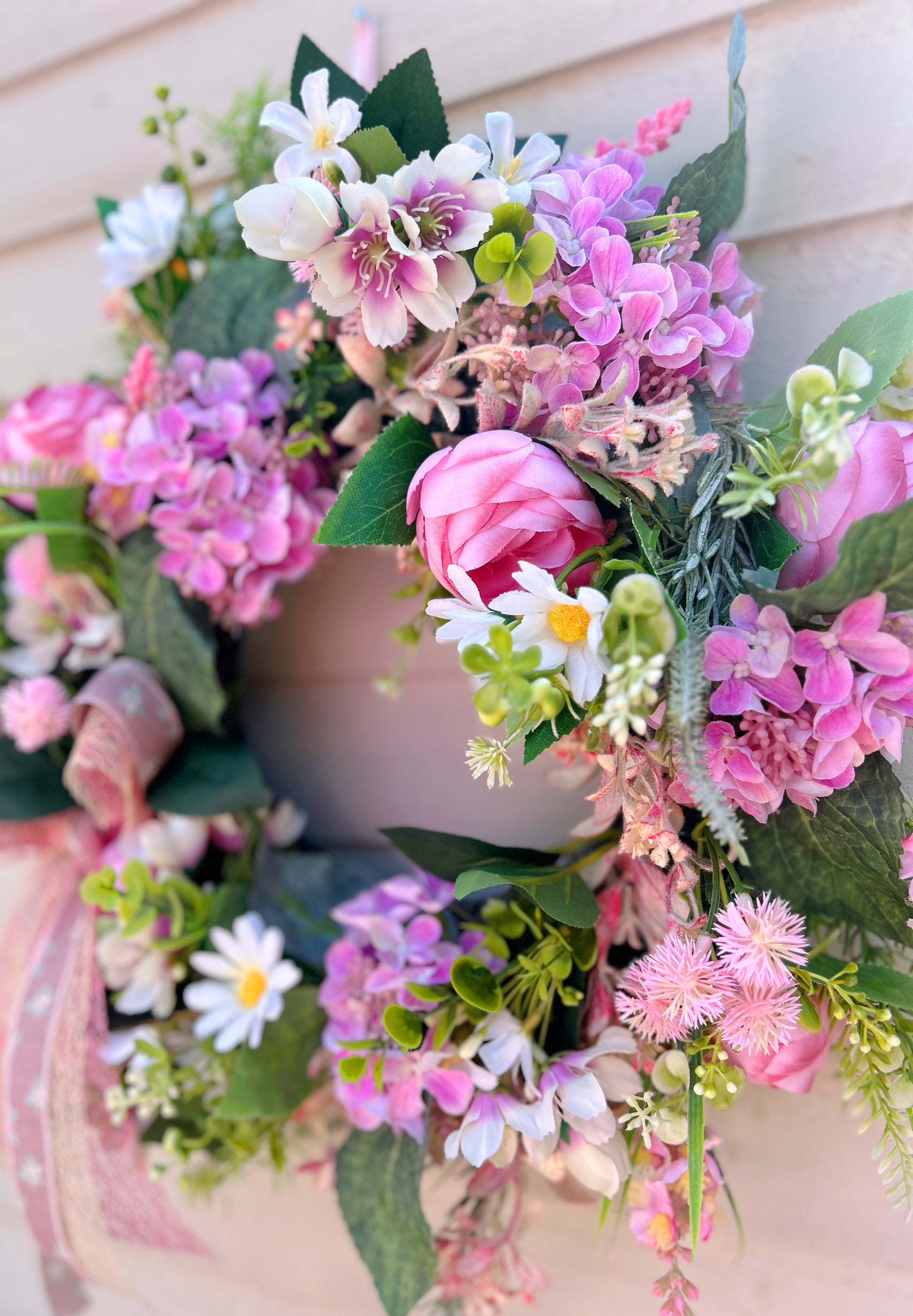 Close up detail of The Burford wreath showing peonies and hydrangeas