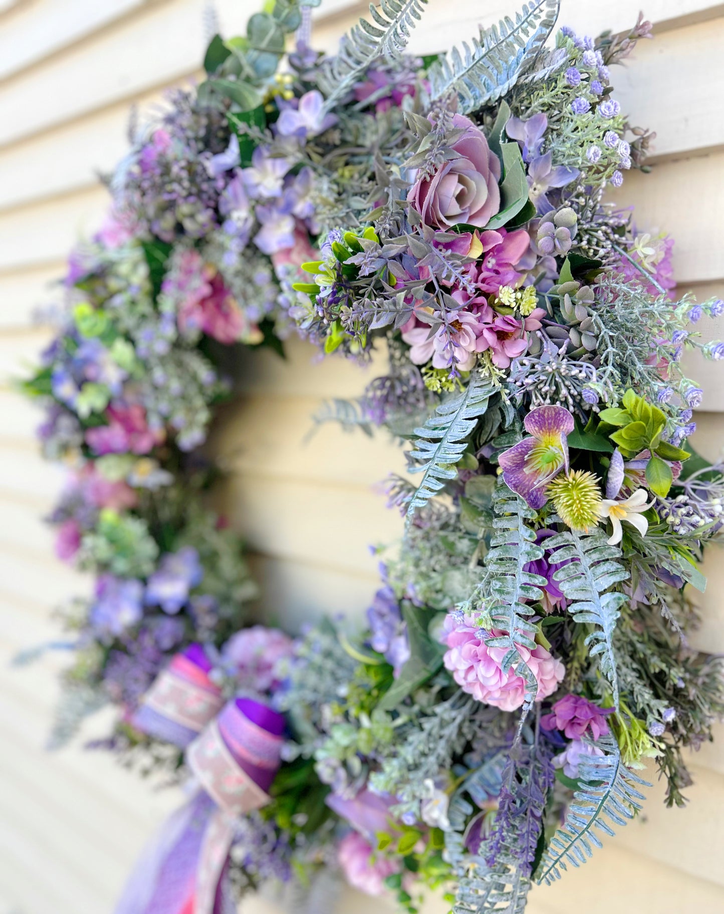 Side detail of The Ambleside wreath showing roses and ribbon