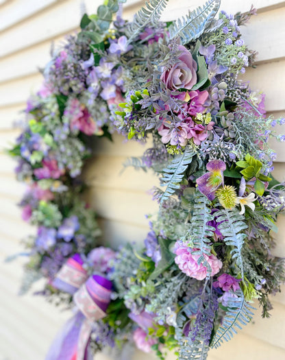 Side detail of The Ambleside wreath showing roses and ribbon
