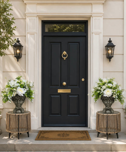 The Ophelia floral face planter flanking a black front door